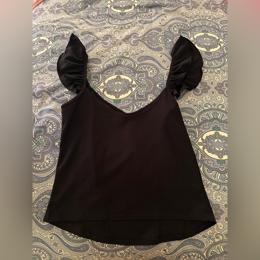 Black tank with frilly staps. Unique and sophisticated. Basically new